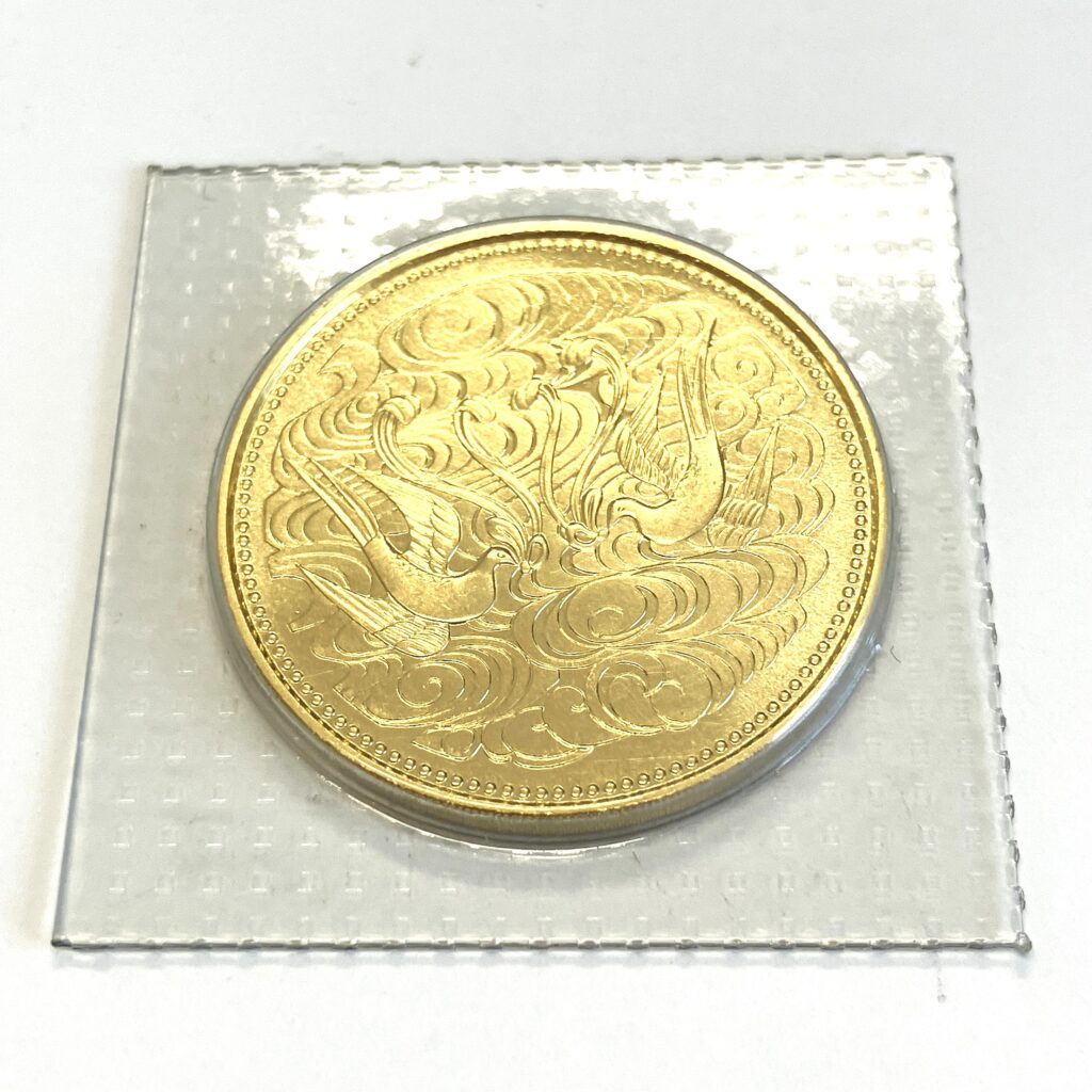 御在位60年記念10万円金貨